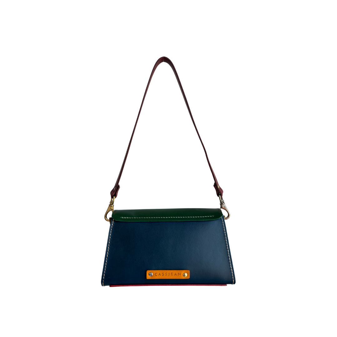 Back view of The Wild Card 2026 leather shoulder bag featuring navy full-grain leather and the CassJean maker’s mark.